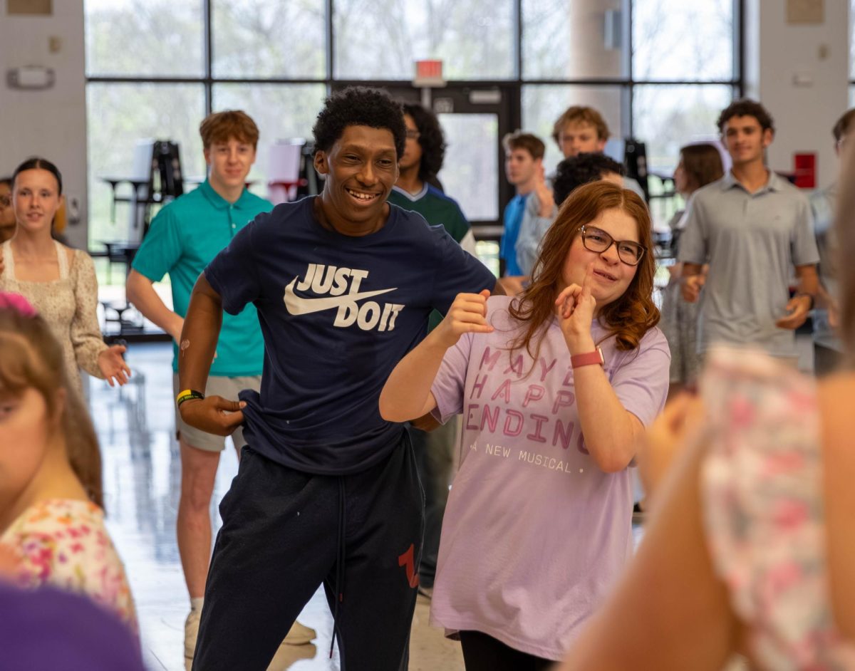 Rod Johnson (12) and Julia Miller (12) dance loud and proud in the dance circle to their peers as music evokes them with happiness at the All of Us dance. 