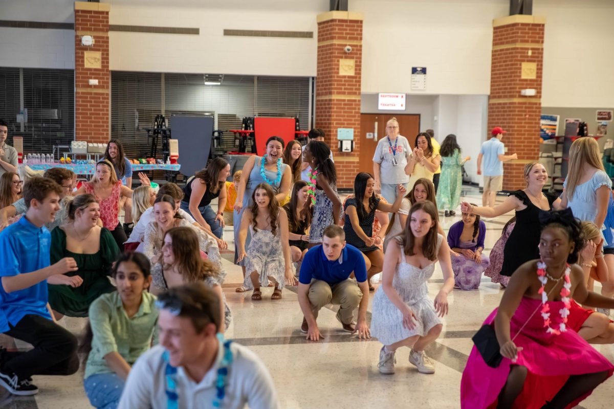 Students do the "Cha Cha Slide" during the All of Us dance. 