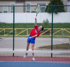 Charles Giraud (12) follows through on a shot in a match in the Show Me MO Holt/Marquette Tournament on April 10.