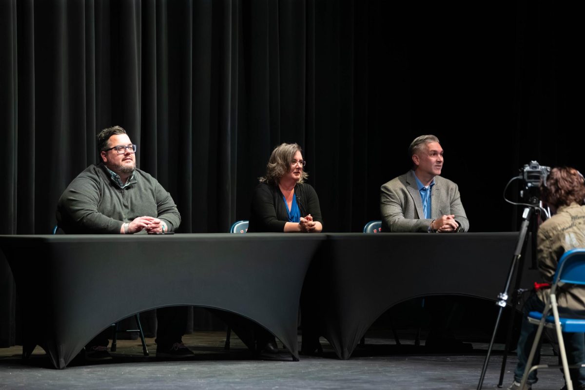 Shaun Johnson, Bert Schultz, Kirby Wilson sits at the table awaiting quesitons.