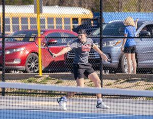 Kaden Brower (11) returns a shot in a match against Francis Howell. 