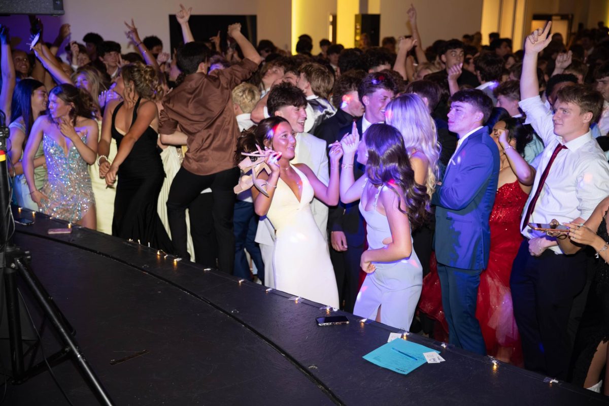 Students dance their hearts out at the front of the stage.
