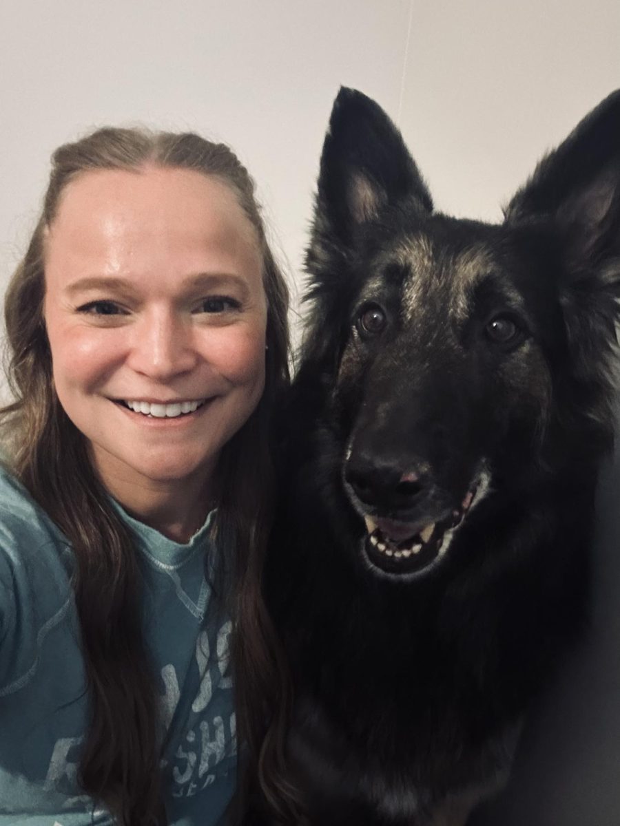 Counselor Paige Blackford with Opie, who was selected as the 2026 Bark Madness winner. Last year's winner was Mrs. Bollwork and her dog.