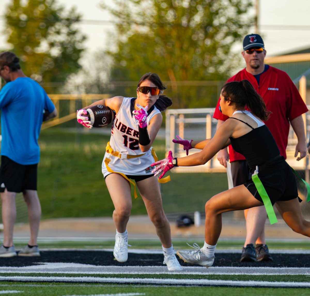 Peyton Nowak (9) dodges a Zumwalt North player as she runs down the field with the ball.