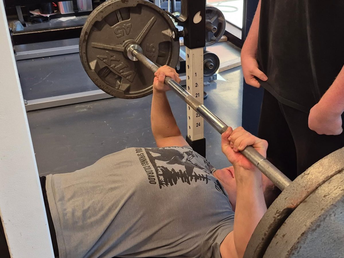 Shane O'Neal (11) goes to rep 225 pounds for bench press.