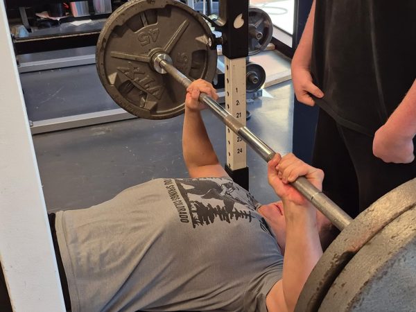 Shane O'Neal (11) goes to rep 225 pounds for bench press.