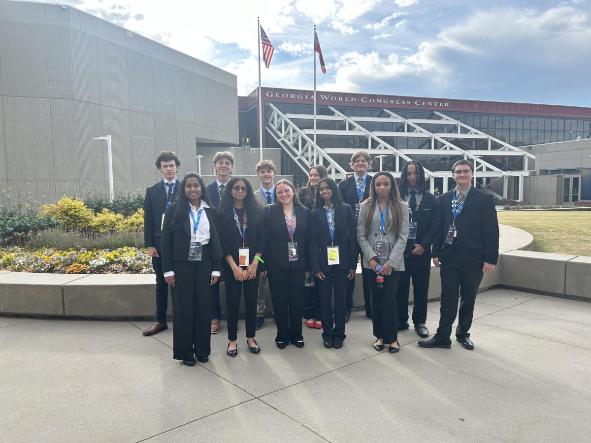 DECA students stand together infront of the World Congress Center before heading out for a day of competition.