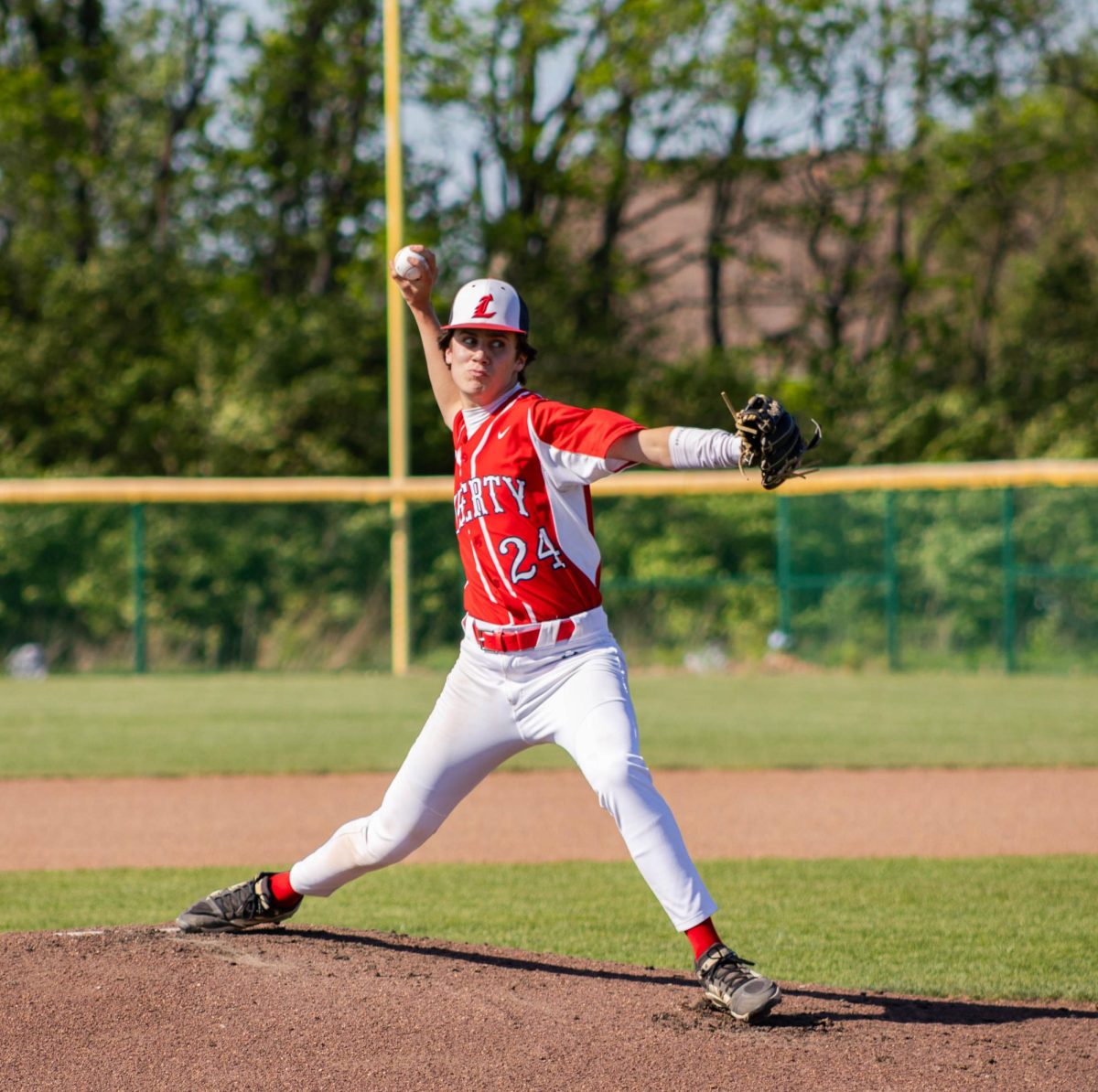 Landon Fuchs (9) pitches the ball, in attempt to strike out a player from North Point.