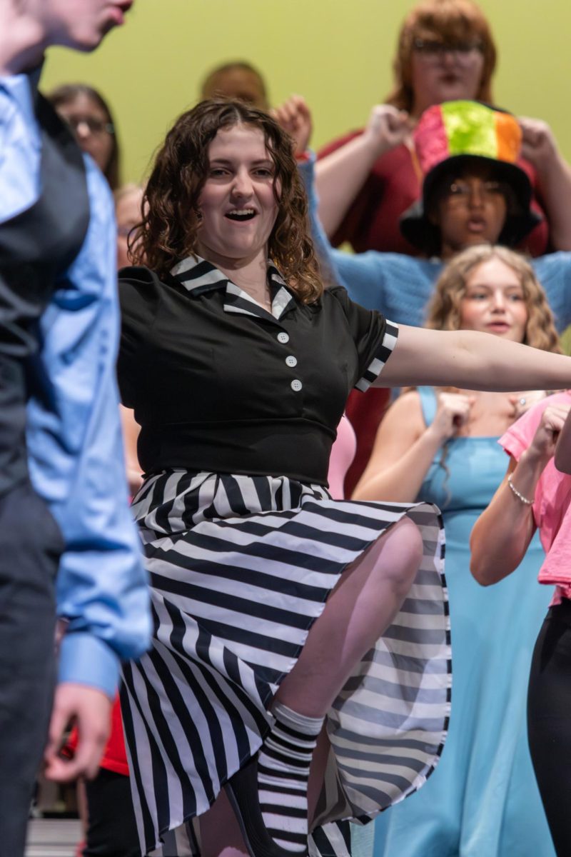 Sadie Dunlap (11) performs in the kickline with the mass choir.