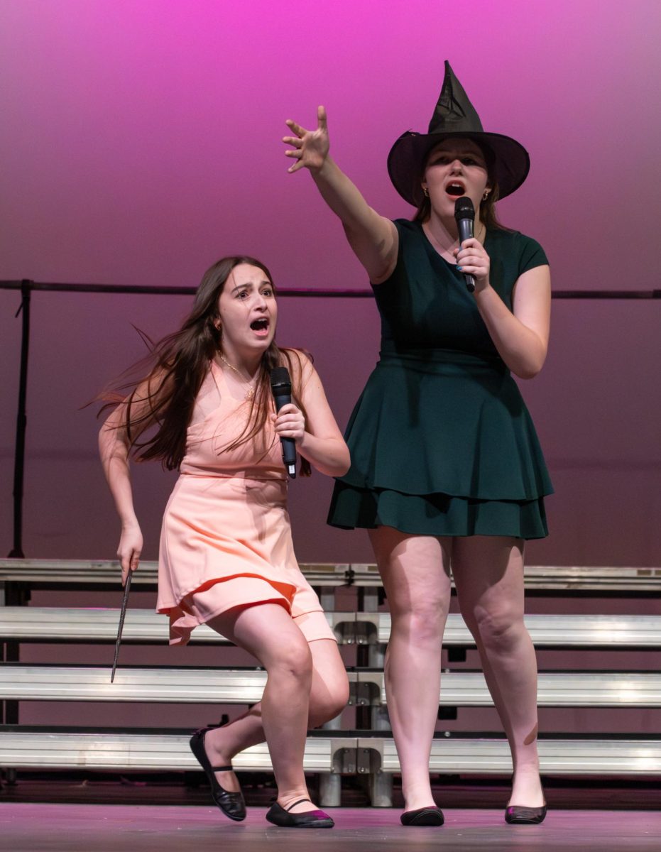 Sofia Shreve (11) and Ellie Force (11) sing a "Wicked" duet. 