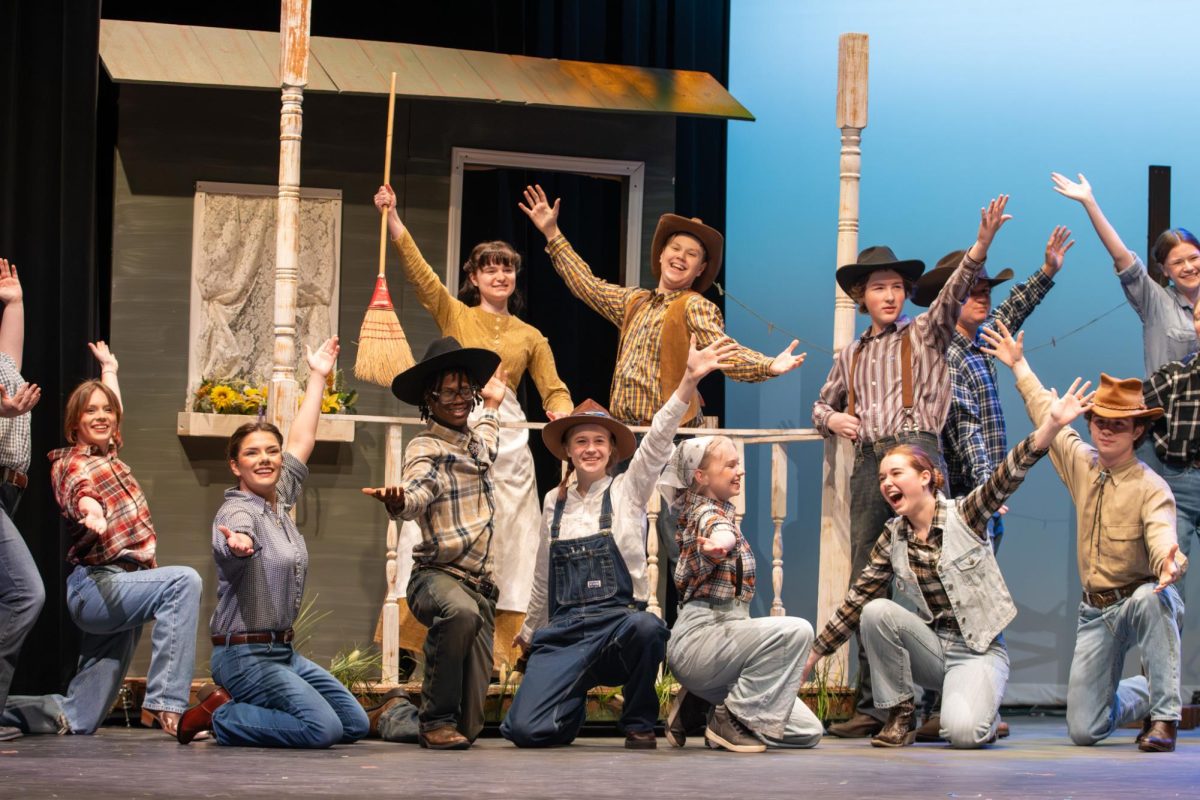 The male ensemble and Aunt Eller, played by Micki Morris (12), sing "Kansas City." During this number, Will Parker, played by Cohen Roach (9), described all the strange things he saw while on a trip to Kansas City, Missouri.