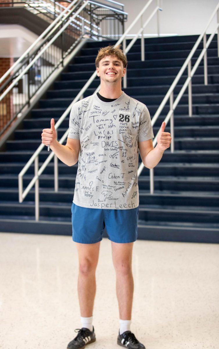 Austin Kelly (12) poses with his 2026 t-shirt that he had all the seniors sign.