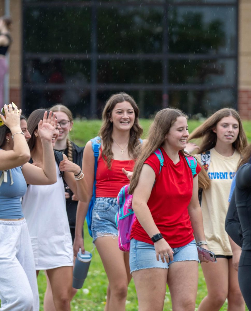 Annie Swift (12) smiles with her friends during the bridgewalk.