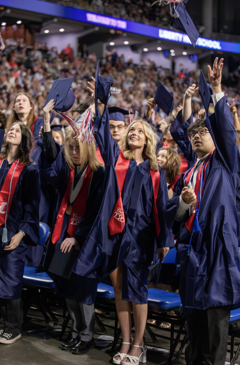 Graduates throw their caps in the air at the conclusion of the commencement. 